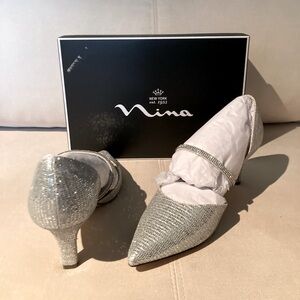 Brand New never worn Silver “Brystol” Nina Pumps. Size 9.